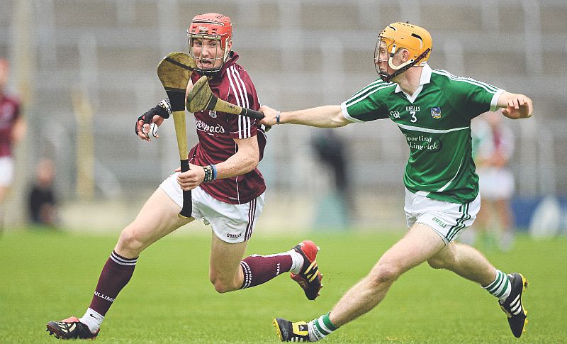 Galway attacker Conor Whelan is pursued by Limerick's Richie English during Saturday evening's All-Ireland U-21 hurling semi-final at Thurles. Photo: Dáire Brennan/Sportsfile.