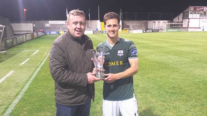 Galway United chairman Jonathan Corbett presents the Galway United Open Jaw Technologies Player of the Month award for June to Jake Keegan following Monday night's League game against Drogheda United.