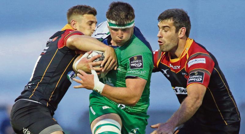 Connacht's Eoghan Masterson is challenged by Newport Gwent Dragons' Nick Scott and Nick Crosswell during Saturday evening's Guinness Pro12 tie at the Sportsground. Photo: Joe O'Shaughnessy.