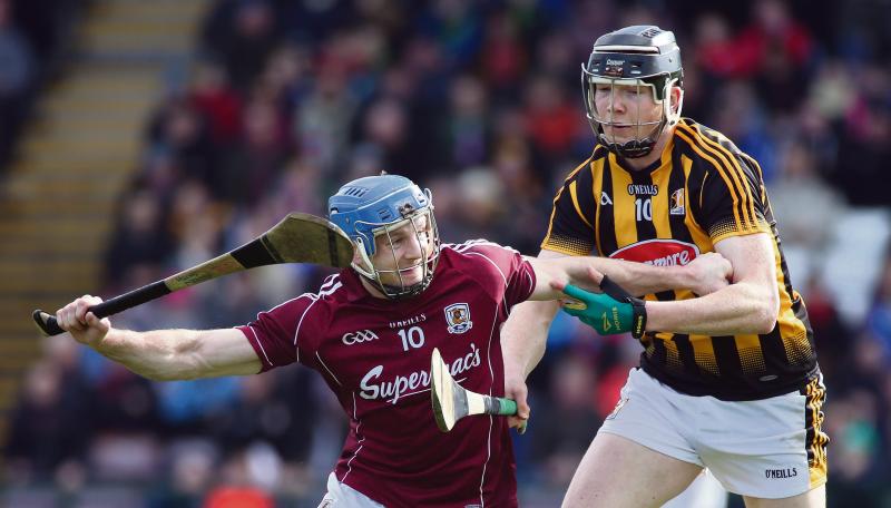 OLD RIVALS: Galway's Andy Smith fends off Kilkenny's Walter Walsh during this year's National League encounter at Pearse Stadium. The stakes will be much higher ar Croke Park on Sunday.