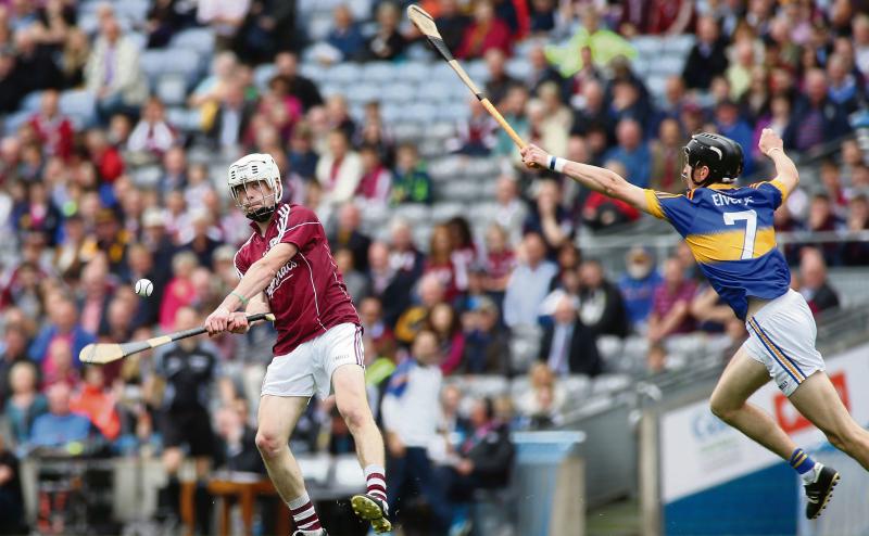 Galway's Jack Coyne picks off a point in the first-half of Sunday's All-Ireland minor hurling final despite the best efforts of Tipperary's Darragh Peters. Photos: Joe O'Shaughnessy