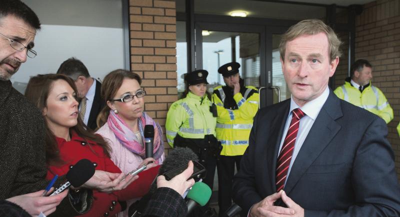 Beware of the microphone...Taoiseach Enda Kenny talks to the media on a previous Galway visit.
