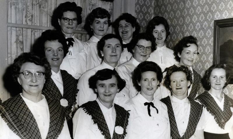 Loughrea ICA gathering during the 1950s: Back: M. Cusack, C. Hanbury, L. Jennings and B. Hennigan. Middle: Mrs. Heary, Mrs. Devine, Mrs Corry and N. Dunn. Front: Mrs. Hanbury, Mrs. Fahy, Mrs. Hession, Mrs. Hope, and T. Barry.