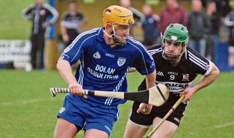 Kiltormer's Kevin McKeigue takes on Pearses Colm Raftery during the clubs' senior hurling championship tie in Loughrea last Saturday. Photos: David Cunniffe.