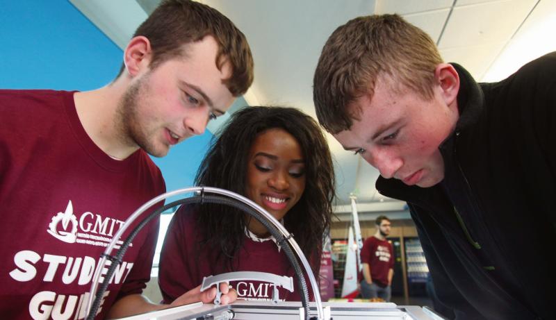 GMIT Mechanical Engineering students Sean Murphy and Jane Egwari pictured with Cathal Curran from Colaiste Colmcille, Inverin, as they examine a 3D printer at GMIT's recent Open Day.