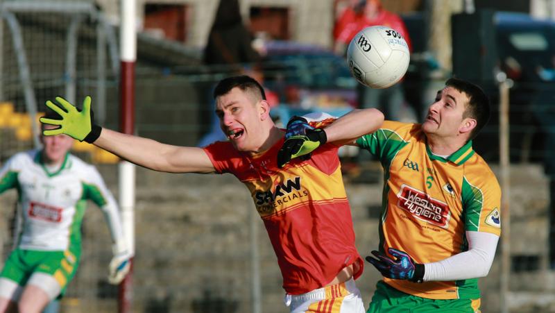 Corofin's Alan Burke and Castlebar Mitchels Barry Moran tussling for possession during Sunday's Connacht Club football final at Pearse Stadium. Photo: Joe O'Shaughnessy.