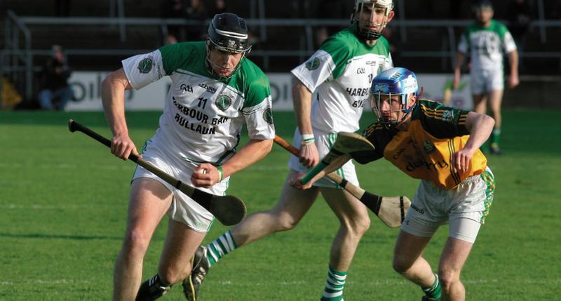 Sarsfields Joseph Cooney takes on Craughwell's Shane Dolan during Sunday's County Hurling Final replay at Pearse Stadium on Sunday. Photo: Enda Noone