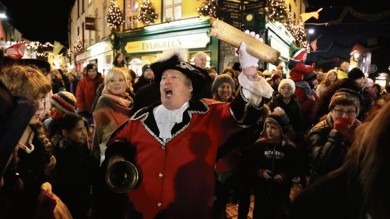 Town Crier Liam Silke spreads some Christmas cheer at the switching-on of the city's Christmas lights last month. There was shouting of a very different kind at the recent City Council meeting, where Chirstmas cheer was in short supply.