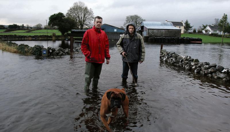 Padraic Collins and Mickey Morgan, Skehanagh, South Galway, whose properties continue to be surrounded by floodwaters. PHOTO: HANY MARZOUK.