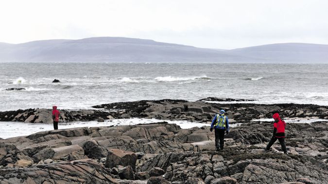 Volunteers help with the search for missing NUI Galway student Michael Bugler during the stormy weather off the coast between Spiddal and Inverin. Photo: Joe O'Shaughnessy.