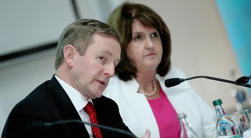 Together but separate... Taoiseach Enda Kenny and Tánaiste Joan Burton.