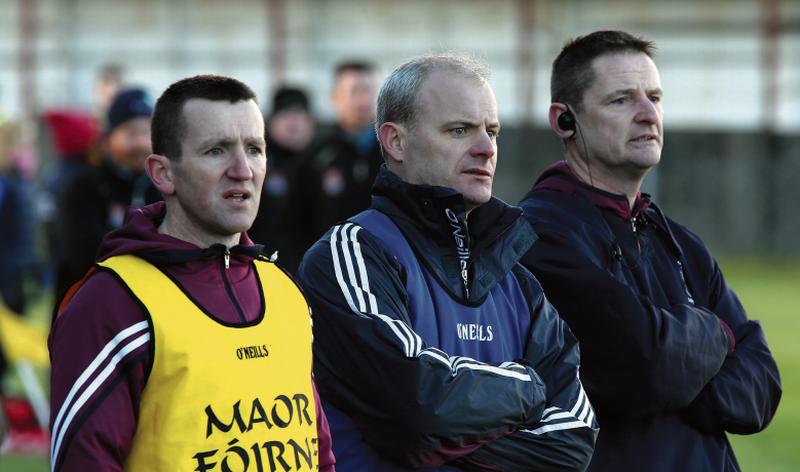 Galway's new senior hurling management team of Francis Forde, Micheál Donoghue and Noel Larkin follow the action in Sunday's Walsh Cup tie against DCU at Duggan Park. Photo: Joe O'Shaughnessy.