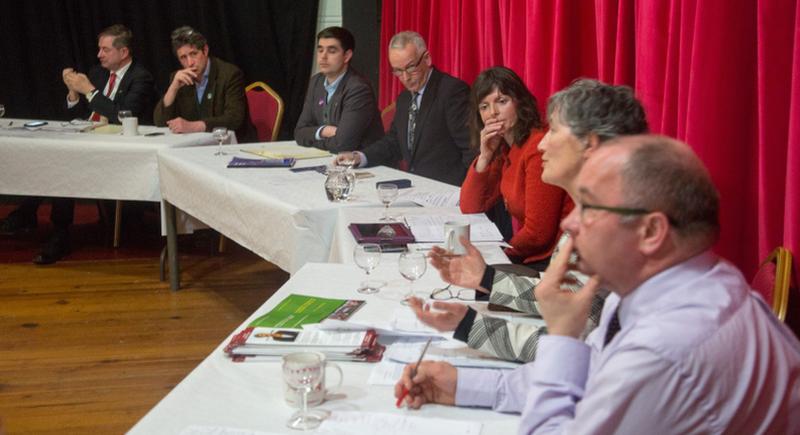 Galway West candidates at this week's meeting in Cois Fharraige, chaired by Gormfhlaith Ní Thuairisg of Raidió na Gaeltachta (third from right). Photo: Seán Ó Mainnín.