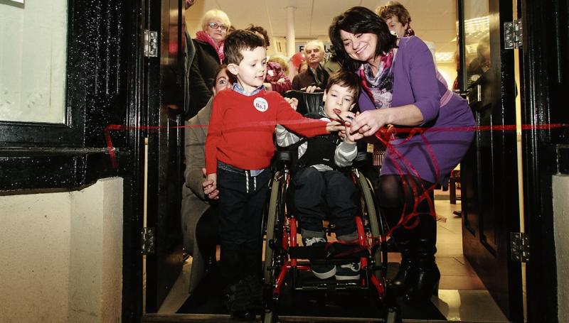 Senator Fidelma Healy Eames together with supporters, being assisted by Tomás McLoughlin and his brother Matthew to cut the tape at the new Campaign Office in Oranmore.