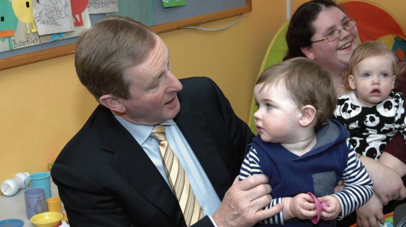 Taoiseich Enda Kenny with Shane Higgins during his visit to Tuam.