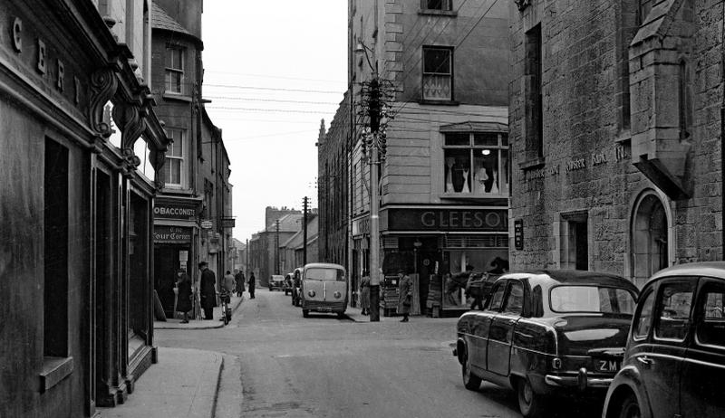 The Four Corners: where Abbeygate St Upper and Abbeygate St Lower meet Shop Street and William Street in the heart of Galway as it looked in the 1950s. A horse-drawn cart can be seen entering the frame on the right, while cars are pointed in both directions on the now-pedestrianised streets. On right was the Munster and Leinster Bank (now AIB).