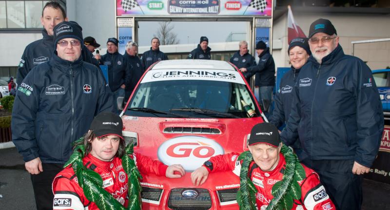 Winners of the Galway International Rally 2016, Gary Jennings and Rory Kennedy pictured with members of the Galway Motor Club at the finish line in the Clayton Hotel on Sunday evening. Photo: Reg Gordon