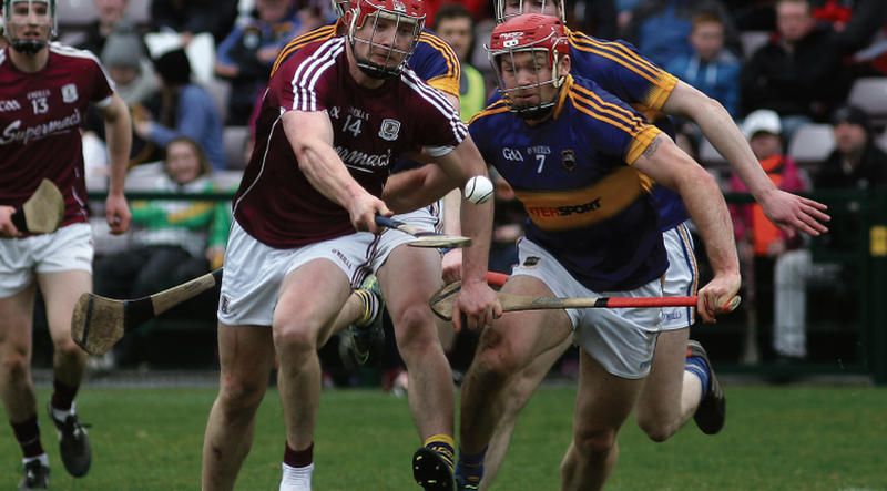 Galway's Joe Canning loses a boot but retains possession despite the close attention of Tipperary's Ronan Maher. Photos: Enda Noone.