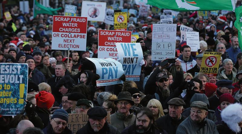 'Ordinary people with caps' . . . tens of thousands of people protest in June, 2015, over the water charges issue. In the end it was the straw that broke the camel's back and eventually brought down a Government.