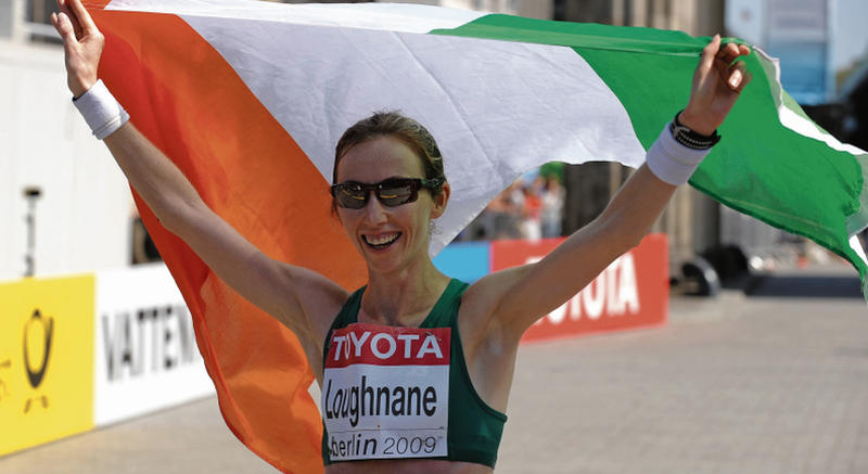 Loughrea's Olive Loughnane celebrates with the Irish tricolour after finishing second in the Women's 20K Walk Final at the World Championships in Berlin in 2009. The Galway athlete has now been awarded the gold medal after the disqualification of Russian winner Olga Kaniskina.