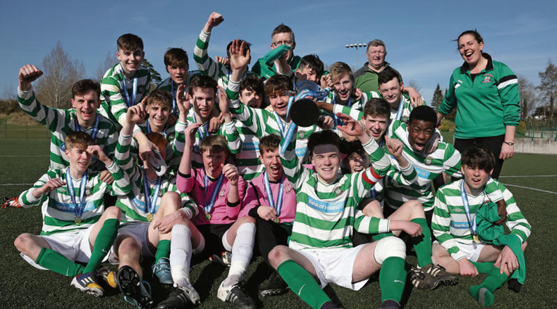The Calasanctius College squad and management celebrate after claiming the SFAI U-17 Cup. Photos: Joe O'Shaughnessy.