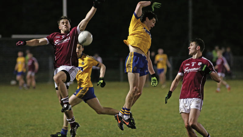 Galway's Brian Shaughnessy and Michael Daly, and Kevin Farrell of Roscommon, compete for a dropping ball in Kiltoom on Friday night. Photos: Joe O'Shaughnessy.