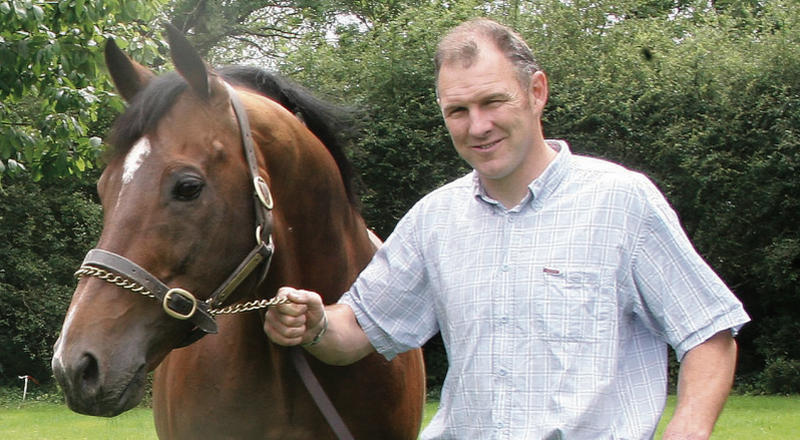 Eamon Hogan with Gamut, one of the stallions standing at Rosshill Farm on the outskirts of the city.