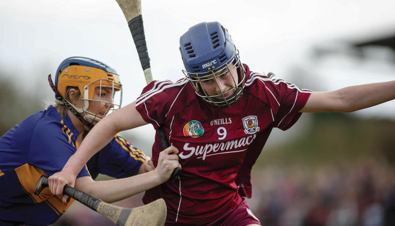 Galway's Leanne Freaney tries to break free from Tipperary's Caroline Mullaney during the All-Ireland minor camogie final in Shinrone on Saturday. Photo: Jeff Harvey/INPHO.