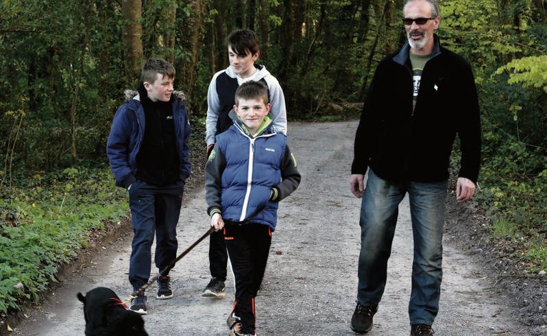 Gabe Cronnelly out for a walk with his sons Michael, Patrick and James with the family dog, Tara. He continues to be acitve as a sportsman and hopes to represent Ireland in the Paralymics in clay-pigeon shooting. PHOTOs: EIREFOTO.