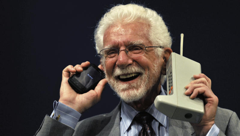 The man who started it all: Chicago born Martin Cooper pictured back in 2009 with his ‘new creation’ from 1973, the first mobile, a Motorola DynaTAC, and his then current phone. The Dynatack weighted about 2.5 pounds (1.1kg), took 10 hours to charge, had talk time of between 20 and 30 minutes and cost $4000 (€3,500, or about €8,000 in today’s values) when it eventually went into production in 1983.