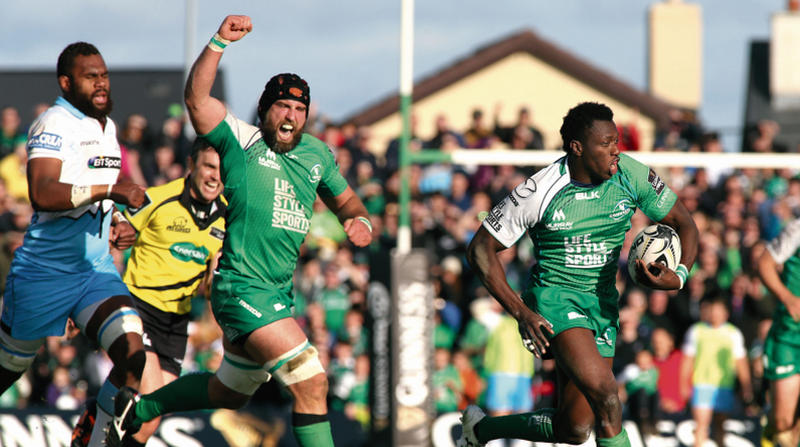 John Muldoon raises his arm in celebration as Niyi Adeolokun races away to score Connacht's try on Saturday. Photo: Joe O'Shaughnessy.