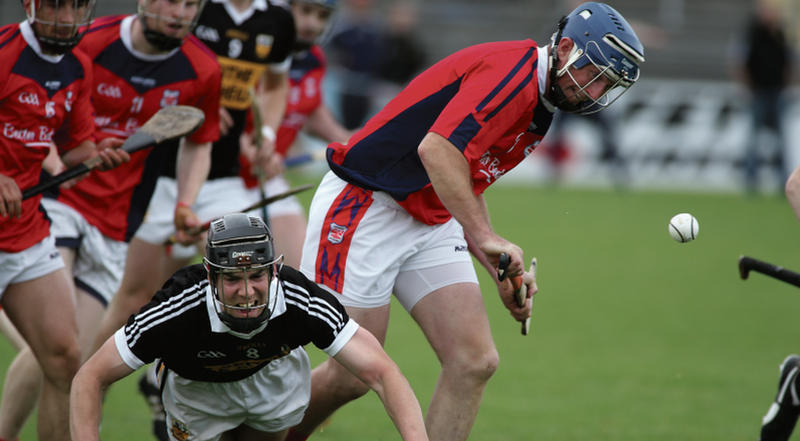 Beagh's Jamie Diviney hits the turf as Abbeyknockmoy's Damien Rooney looks to secure possesion. Photo: Joe O'Shaughnessy.