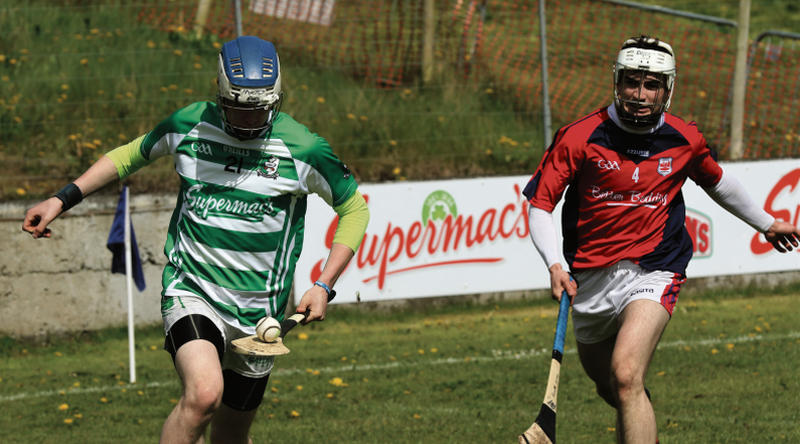 Killimordaly's Niall O'Kane races away from Abbeyknockmoy corner back Kenneth Garvey during their Senior B Championship encounter in Ballinasloe. Photos: Joe Keane.