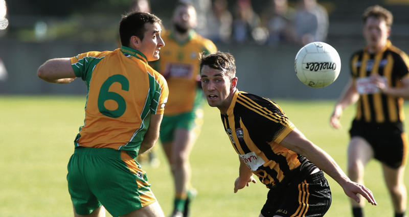 EYES ON THE PRIZE: Corofin's Alan Burke and Mountbellew-Moylough's Cathal Kenny in action during last year's Galway football final.