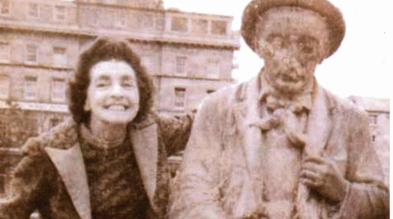 This photograph was taken in the late 1960s. It shows Nora Divilly (nee Cosgrave) seated on the statue of Padraic O'Coniare which was a popular spot for photos while it was in Eyre Sqaure from 1935 until it was vandalised in 1999. Nora Divilly was the wife of Martin Divilly who served two terms as Mayor of Galway in 1963-64 and 1970-71. Photo courtesy of Rosemary Divilly.