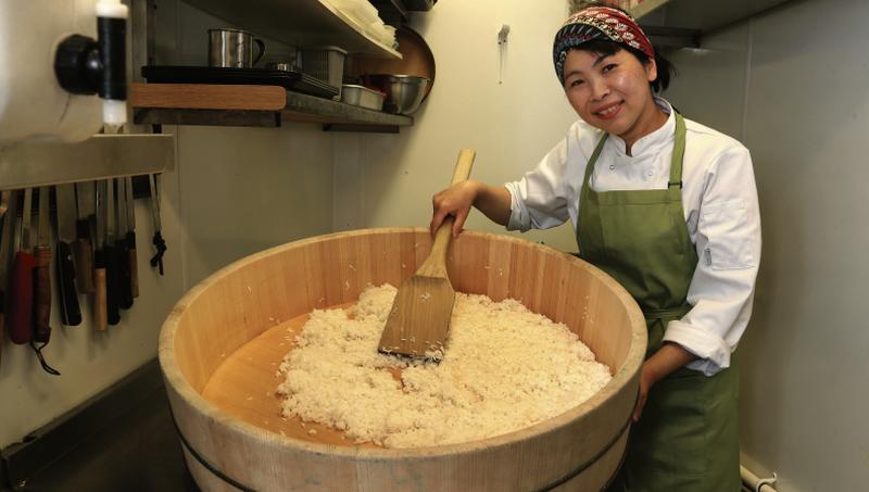 Yoshimi Hayakawa making sushi rice in a sushi oke (wooden bowl). “It’s simple, but there’s a lot of work. New chefs here are surprised that we do preparation for the preparation,” says Yoshimi of the process involved in setting up the kitchen every day. Photo: Joe O'Shaughnessy.
