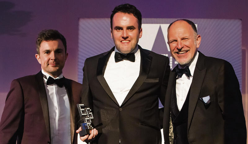 Element Wave Commercial Manager William Morris (centre) accepting the award at EGR B2B held in the Tower of London last week. Also pictured are Sam Compagnoni, Group Commercial Manager at Pageant Gaming Media, and Simon Evans, Host.