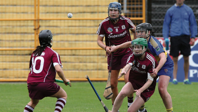 Anne Marie Starr manages to get possession to Aoife Donoghue despite the pressure from Tipperary's Mary Ryan, as Clodagh McGrath looks on. Photos: Joe O'Shaughnessy.