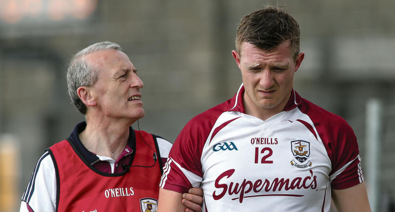 Galway Team Doctor Ian O'Connor checks out Joe Canning's neck injury after he was struck off the-ball in Sunday's Leinster Championship quarter final against Westmeath in Mullingar. The incident led to the dismissal of defender Shane Power. Photo: Joe O'Shaughnessy.