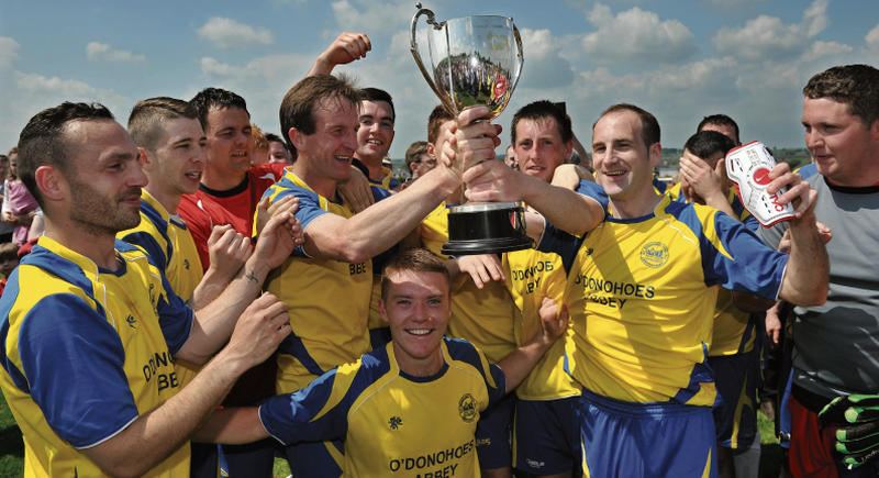 Darren Finn, St. Bernard's captain, celebrates with his team mates after defeating Mervue United to take the Premier League title at Abbeyknockmoy on Sunday. Photos: Joe O'Shaughnessy.