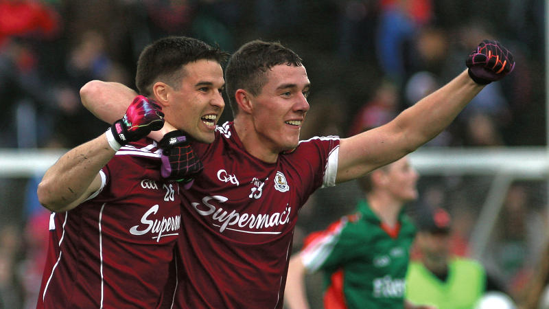 Sean Denvir and Eamon Brannigan celebrate after the final whistle in McHale Park on Saturday. Photos: Enda Noone.