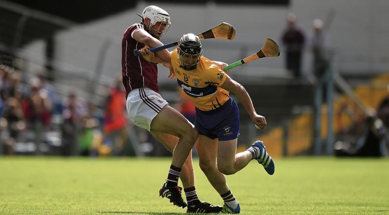 Galway's Gearóid McInerney halts the progress of Clare's John Conlon during Sunday's All-Ireland hurling quarter-final at Semple Stadium. Photo: Daire Brennan/Sportsfile.