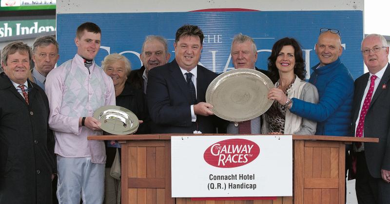 Shay Livingstone presents the winning trophy to Tom Egan after Swamp Fox won the Connacht Hotel Handicap at Ballybrit on Monday evening. Also in photo are Joseph Murphy, trainer, Seamus Donnigan, Barry Browne, winning jockey, Una and Dominic Glennane, Marian Dolan, John Fleming and Peter Allen, Chairman, Galway Race Committee. Photos: Iain McDonald.