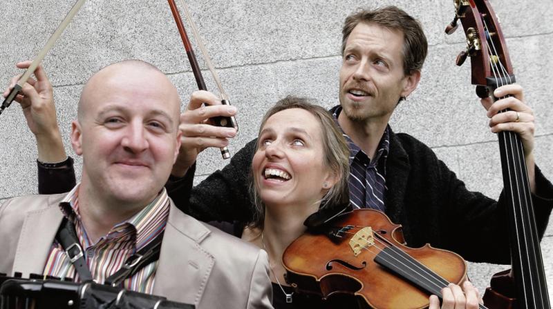 Dermot Dunne (accordian), Katherine Hunka (violin), and Malachy Robinson (double bass).