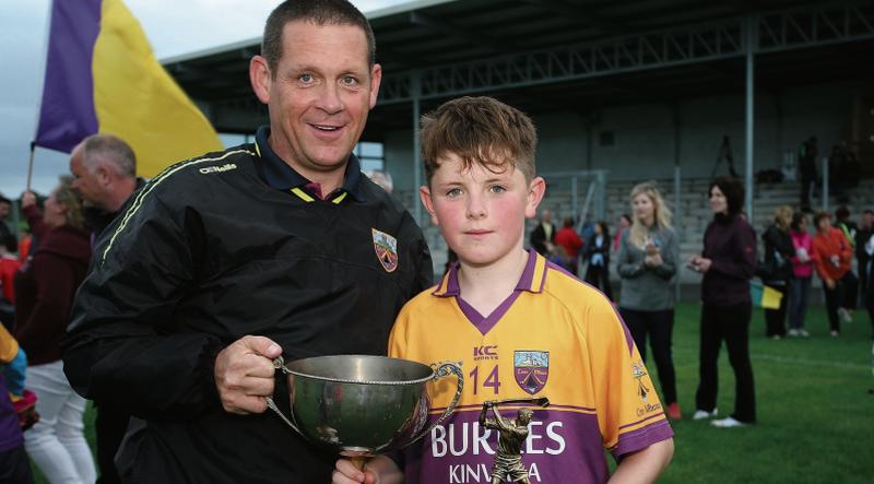 A proud dad Michael Helebert with his son Darragh, Captain and Player of the Match in Kinvara's County U13 B hurling title success.