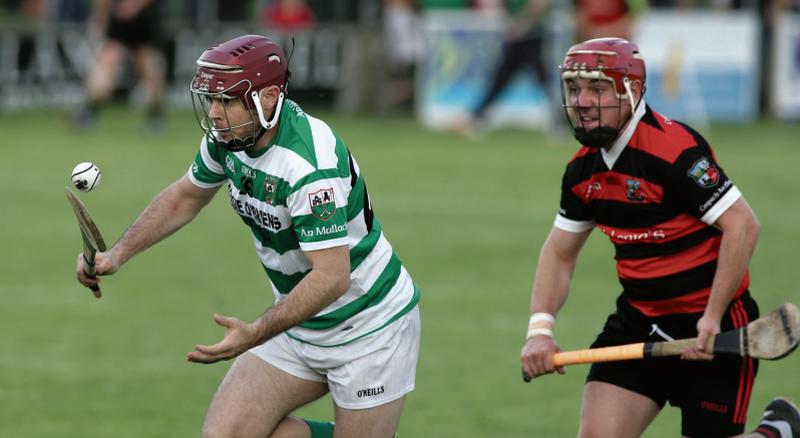 Mullagh's Daniel Whyte breaking away from Cappataggle's Stephen Creaven during Saturday evening's preliminary quarter-final at Duggan Park. Photos: Joe O'Shaughnessy.