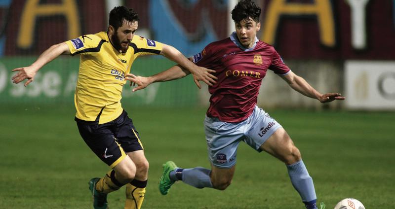 Galway United's Kevin Devaney in a race for possession with Longford Town's Jamie Mulhall during the clubs' Premier Division tie at Eamonn Deacy Park on Friday night. Photo: Joe O'Shaughnessy.