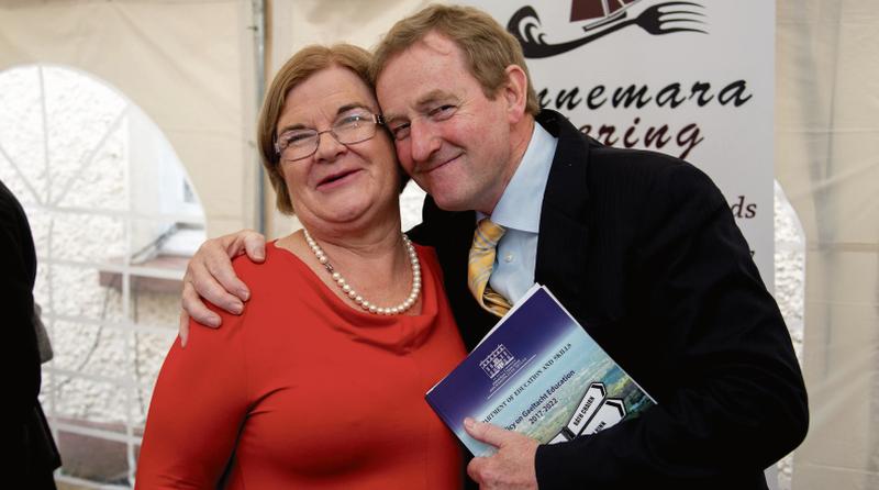 Slán agus buíochas…Taoiseach Enda Kenny gives Scoil Mhic Dara principal Mairéad Mhic Dhonncha a goodbye hug.