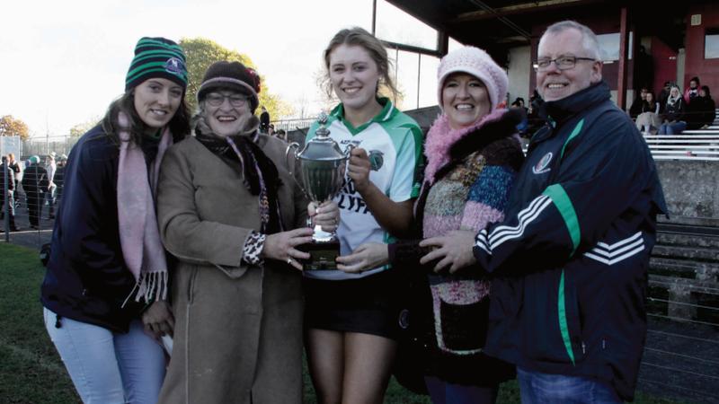 Kate Gallagher, Josie Deeley, Sarah, Marella and Brian Gallagher with the County Minor A camogie cup after Sarsfields’ victory over Oranmore/Maree last Sunday.