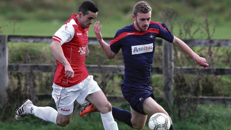 Colga's Neil Greaney tussling for possession with Brian Carroll of Bohemians during Sunday's Joe Ryan Cup tie at Millars Lane. Photo: Joe O'Shaughnessy.